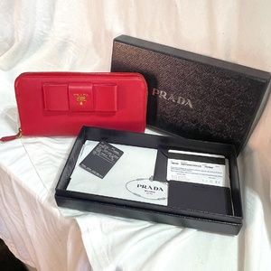 Authentic Prada Pink Saffiano leather zip around wallet w/bow and cert card